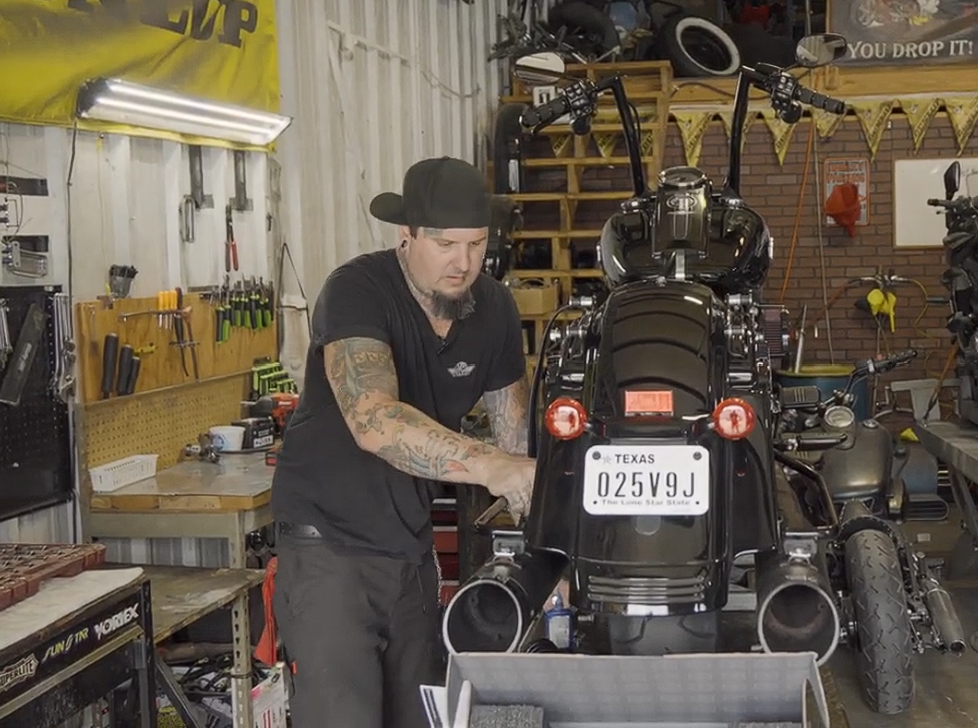 AJ Brown working on a motorcycle at Chop Shop Motorsports